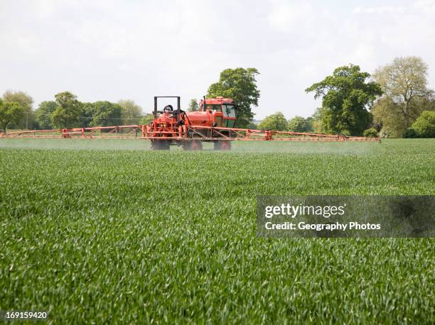 Spraying arable crop, Sutton, Suffolk, England