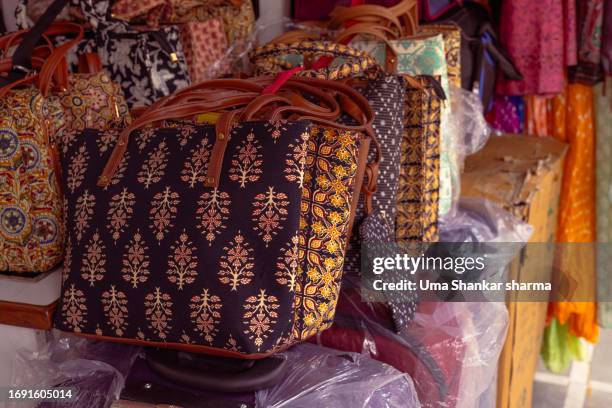 printed handbags and purse for sale. - handbag illustration stock pictures, royalty-free photos & images