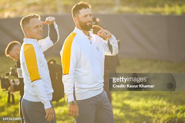 Team Europe Captain Luke Donald and Jon Rahm of Team Europe look on during a team photo call prior to the 2023 Ryder Cup at Marco Simone Golf Club on...