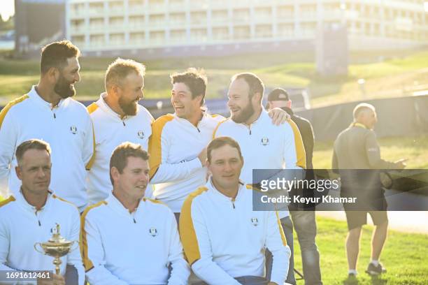 Team Europe players Jon Rahm, Shane Lowry, Viktor Hovland and Tyrrell Hatton smile during a team photo call prior to the 2023 Ryder Cup at Marco...