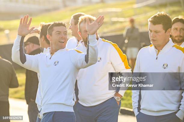 Rory McIlroy of Team Europe smiles and waves to fans during a team photo call prior to the 2023 Ryder Cup at Marco Simone Golf Club on September 26,...