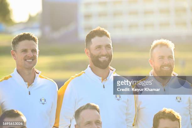 Team Europe players Justin Rose, Jon Rahm and Shane Lowry smile during a team photo call prior to the 2023 Ryder Cup at Marco Simone Golf Club on...