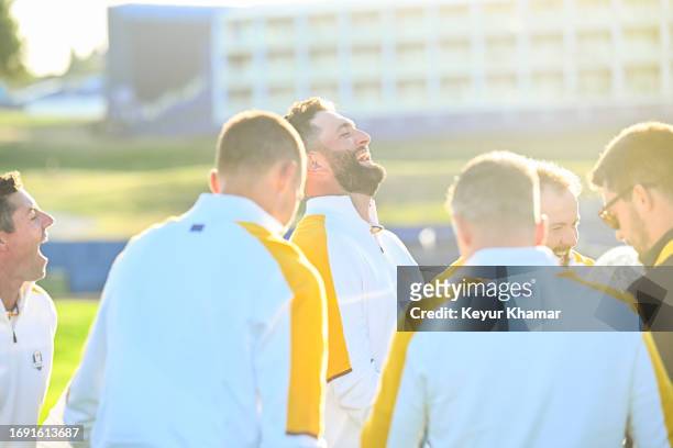 Team Europe players Jon Rahm, Shane Lowry and Rory McIlroy smile during a team photo call prior to the 2023 Ryder Cup at Marco Simone Golf Club on...