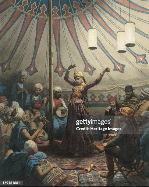Egyptian dancer in a tent, with musicians and spectators, 1868 or later. Danseuse Egyptienne . Creator: Willem de Famars Testas.