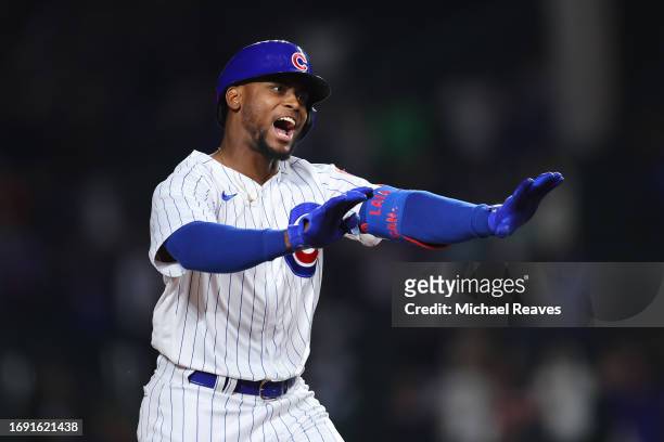 Alexander Canario of the Chicago Cubs celebrates after hitting a grand slam off Kyle Nicolas of the Pittsburgh Pirates during the eighth inning at...
