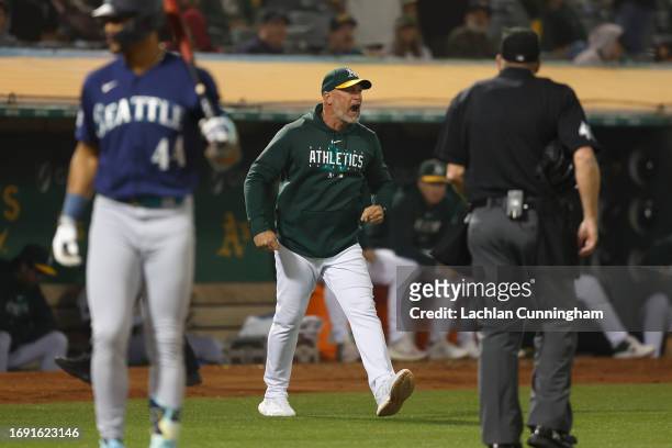 Manager Mark Kotsay of the Oakland Athletics argues with first base umpire Jansen Visconti after being ejected from the game against the Seattle...