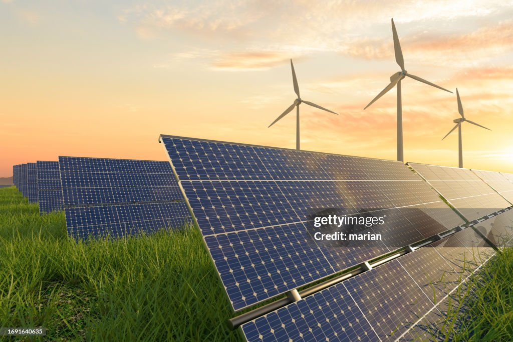 Solar panels and wind turbines under sunlight