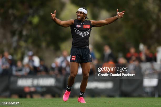 Isaac Quaynor of the Magpies reacts during a Collingwood Magpies AFL training session at Olympic Park Oval on September 20, 2023 in Melbourne,...