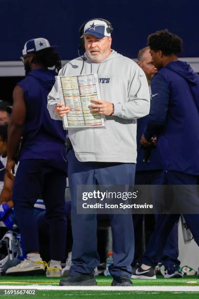 Dallas Cowboys head coach Mike McCarthy looks over his play sheet during the game between the Dallas Cowboys and the New York Jets on September 17,...