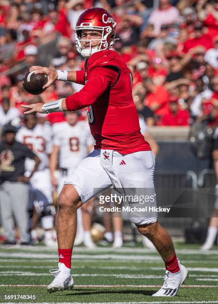 Jack Plummer of the Louisville Cardinals rolls out to pass during the game against the Boston College Eagles at Cardinal Stadium on September 23,...