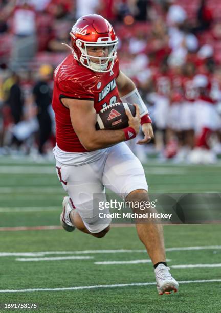 Brock Domann of the Louisville Cardinals runs the ball during the game against the Boston College Eagles at Cardinal Stadium on September 23, 2023 in...