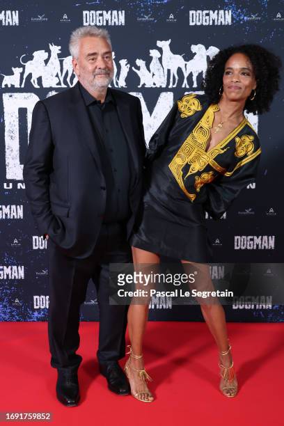 Luc Besson and Virginie Besson-Silla attend the "Dogman" premiere at Cinema UGC Normandie on September 19, 2023 in Paris, France.