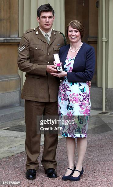 Kerry Ashworth, who received the Victoria Cross conferred on her late son Lance Corporal James Ashworth, poses for a picture as she stands with her...