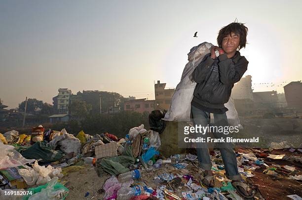 Children live, play and work on the garbage dump at Bhagmati River in the middle of the city. The garbage collected off the streets of the capital...