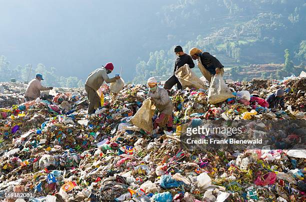 Workers sorting out garbage at Aletar garbage dump. The garbage collected off the streets of the capital city is mostly sorted for recycling by...