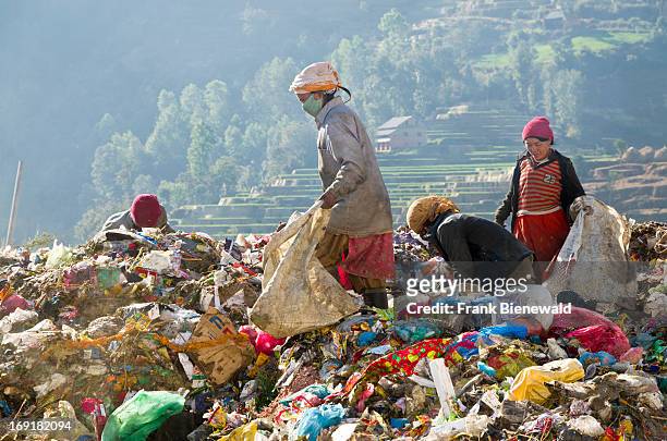 Women sorting out garbage at Aletar garbage dump. The garbage collected off the streets of the capital city is mostly sorted for recycling by...