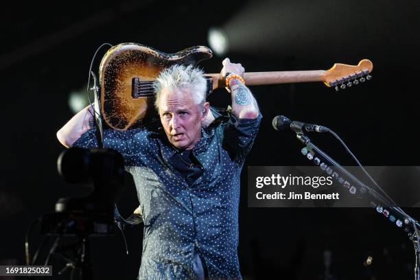 Lead guitarist Mike McCready of Pearl Jam plays a solo behind his head live on stage at Moody Center on September 19, 2023 in Austin, Texas.