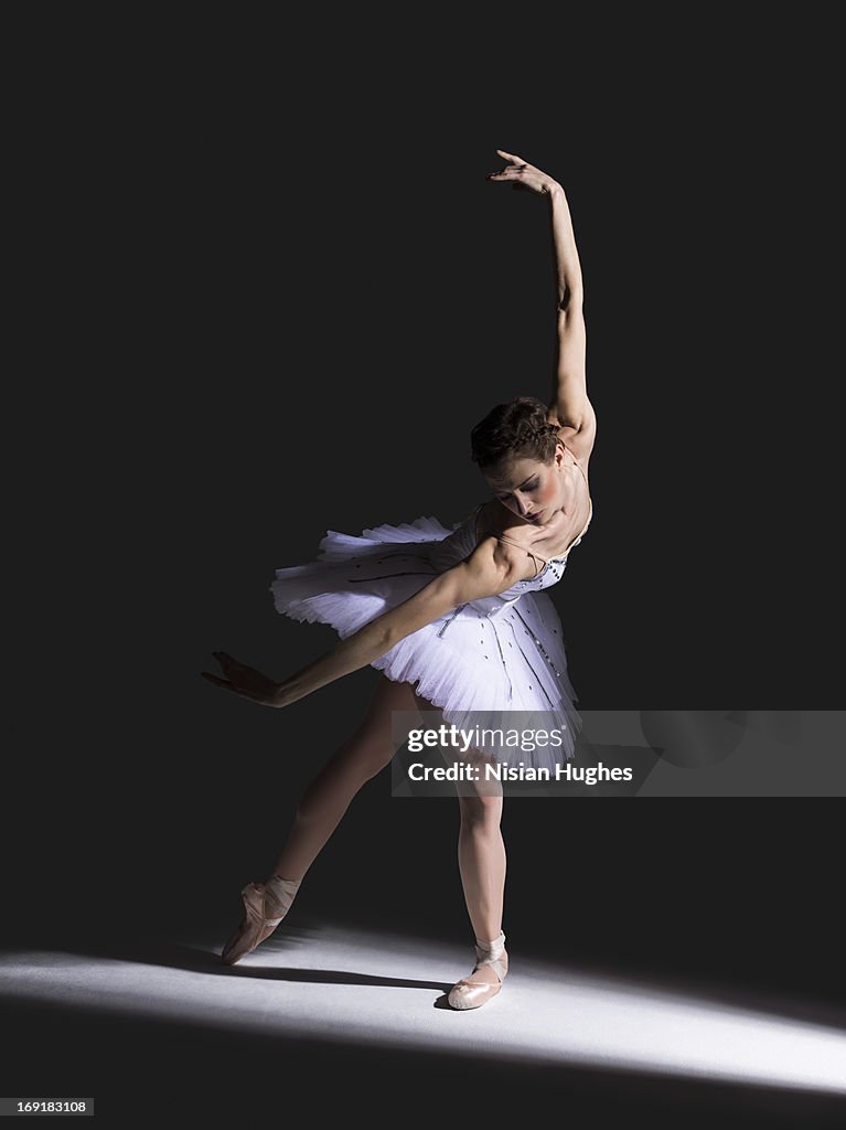Ballerina performing port de bras wearing tutu
