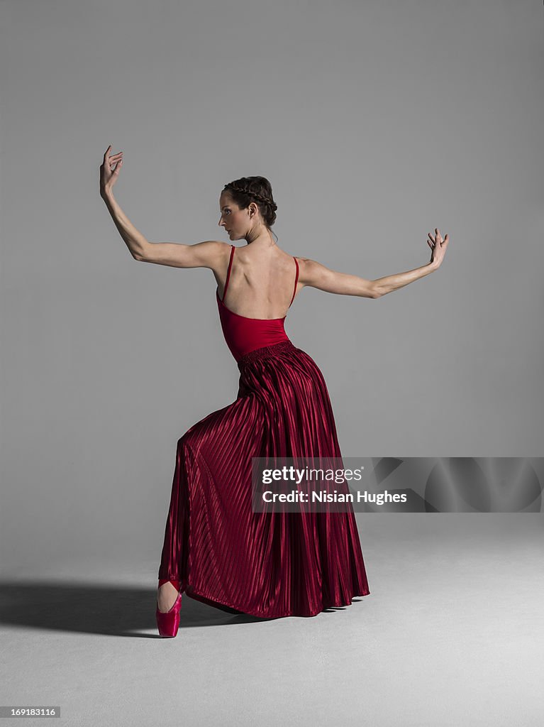 Ballerina performing Ballet back in red