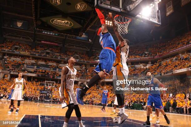 Roy Hibbert of the Indiana Pacers blocks a dunk attempt by Carmelo Anthony of the New York Knicks in Game Six of the Eastern Conference Semifinals...