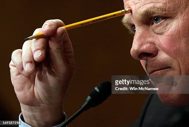 Sen. Richard Burr questions current and former IRS employees while the testify before the Senate Finance Committee May 21, 2013 in Washington, DC....