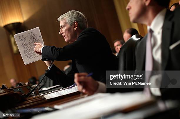 Sen. Rob Portman questions current and former IRS employees while the testify before the Senate Finance Committee May 21, 2013 in Washington, DC. The...