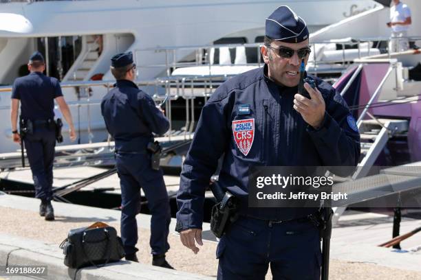 Police evacuate the area beside the Palais de Festival due to an unattended bag being left on the ground on May 20, 2013 in Cannes, France. There is...