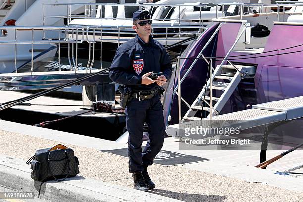Police evacuate the area beside the Palais de Festival due to an unattended bag being left on the ground on May 20, 2013 in Cannes, France. There is...