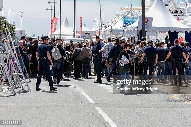 Police evacuate the area beside the Palais de Festival due to an unattended bag being left on the ground on May 20, 2013 in Cannes, France. There is...