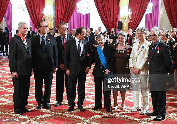 French president Francois Hollande poses with , general honorary prosecutor Henri Desclaux, lawyer Christian Charriere-Bournazel, chairman of the...