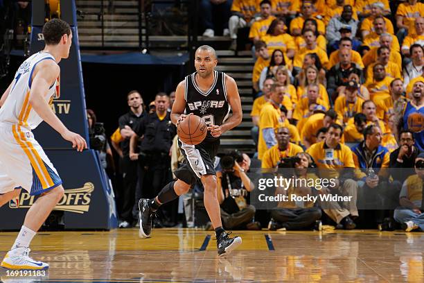 Tony Parker of the San Antonio Spurs brings the ball up the court against Klay Thompson of the Golden State Warriors in Game Six of the Western...
