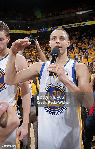 Stephen Curry of the Golden State Warriors thanks fans for their continued support throughout the season after falling to the San Antonio Spurs in...