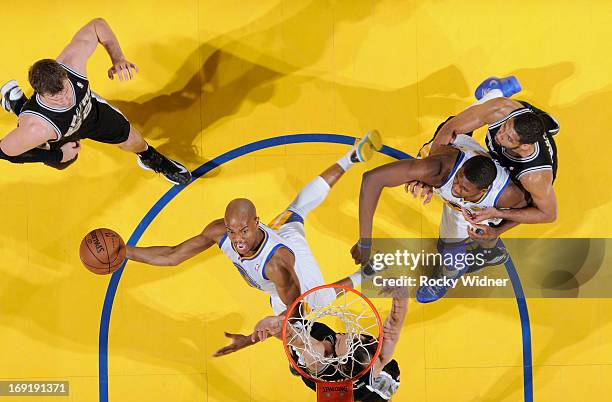 Jarrett Jack of the Golden State Warriors shoots a layup against Manu Ginobili of the San Antonio Spurs in Game Six of the Western Conference...