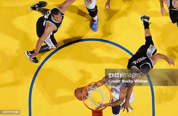 Jarrett Jack of the Golden State Warriors puts up a shot against Tim Duncan of the San Antonio Spurs in Game Six of the Western Conference Semifinals...
