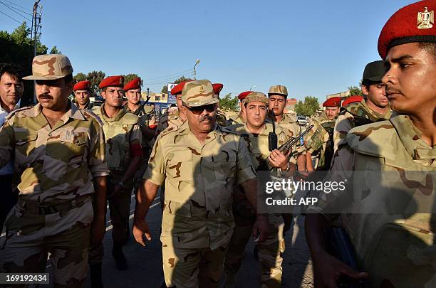 Commander of the Second Field Army Ahmad Wafsi arrives in the Rafah Crossing border between Egypt and the Gaza Strip on May 21, 2013 as Egypt...