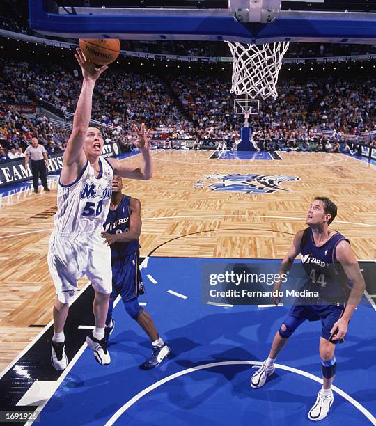 Mike Miller of the Orlando Magic goes up for the shot during the game against the Washington Wizards at TD Waterhouse Centre on December 6, 2002 in...