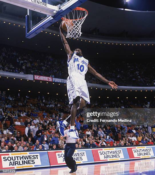 Darrell Armstrong of the Orlando Magic takes the ball up for the dunk during the game against the Washington Wizards at TD Waterhouse Centre on...