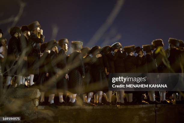 Ultra-Orthodox Jews of the Belz Hasidic Dynasty watch the wedding ceremony of Rabbi Shalom Rokach, the Grandson of the Belz Rabbi to Hana Batya...