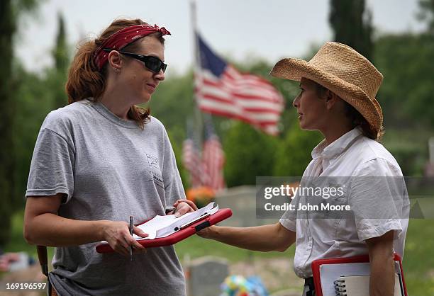 Forensic anthropologists Krista Latham from the University of Indianapolis and Lori Baker from Baylor University speak as their teams exhume the...