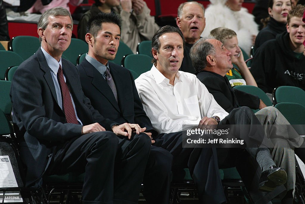 Ichiro Suzuki and Howard Schultz sit courtside