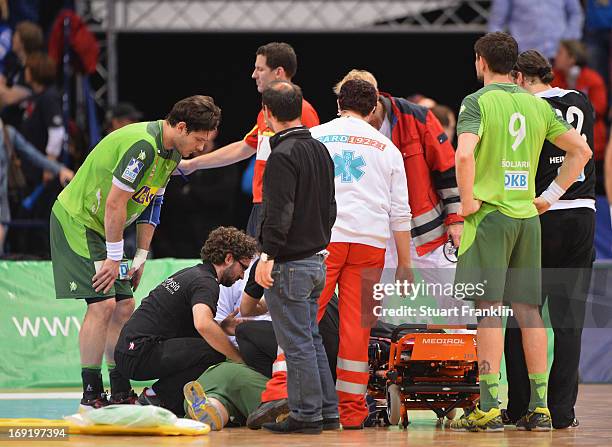 Ivan Nincevic of Berlin receives treatment for a serious injury during the DKB Bundeliga match between HSV Hamburg and Fuechse Berlin at O2 World on...