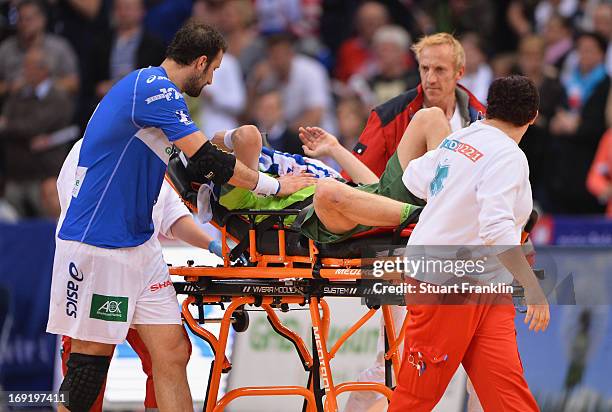 Ivan Nincevic of Berlin receives treatment for a serious injury during the DKB Bundeliga match between HSV Hamburg and Fuechse Berlin at O2 World on...