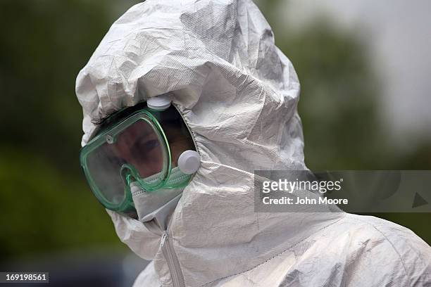 Forensic anthropology team member from Baylor University prepares to exhume the remains of immigrants at a cemetery on May 21, 2013 in Falfurrias,...