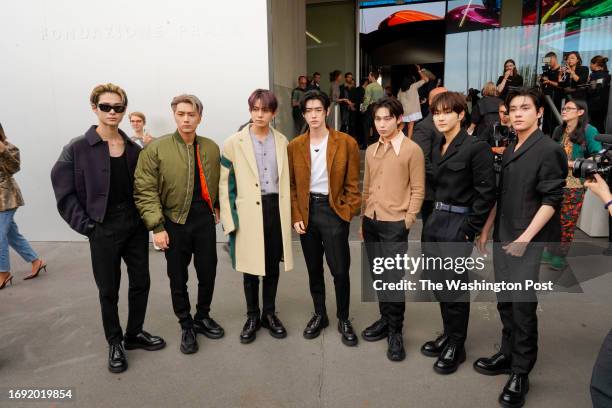 Members of K-pop group Enhypen arrive at Prada fashion show during Milan Fashion Week, September 21 2023.