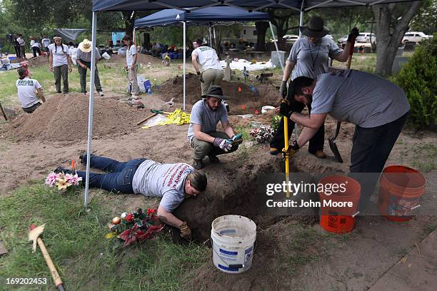 Forensic anthropology team from the University of Indianapolis unearths the remains of unidentified immigrants from a cemetery on May 21, 2013 in...