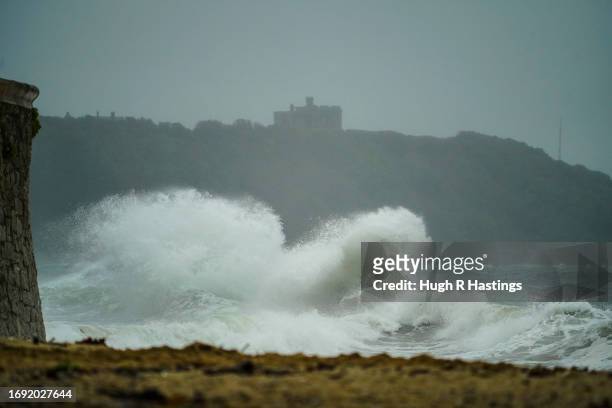 Stormy waves reach up to Pendennis Castle at Gyllyngvase Beach on September 20, 2023 in Falmouth, England. Parts of England are experiencing strong...