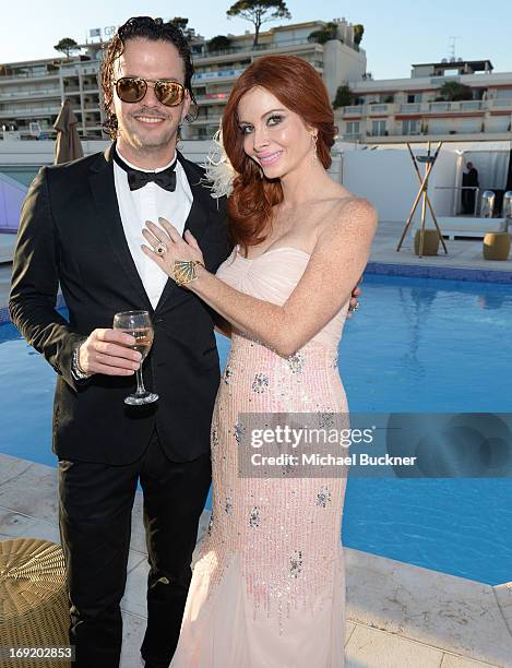 Designer Gil Newhaus and Phoebe Price attend the Summertime Entertainment's Cannes Animation Celebration Cocktail Party during the 66th Annual Cannes...