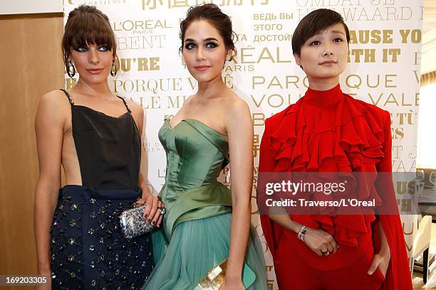 Milla Jovovich, Araya A. Hargate and Li Yuchun attend the L'Oreal Cocktail Reception during The 66th Cannes Film Festival on May 21, 2013 in Cannes,...