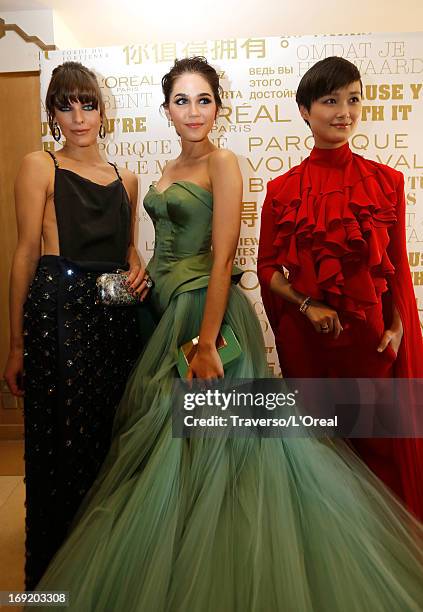 Milla Jovovich, Araya A. Hargate and Li Yuchun attend the L'Oreal Cocktail Reception during The 66th Cannes Film Festival on May 21, 2013 in Cannes,...