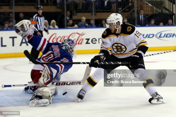 Henrik Lundqvist of the New York Rangers makes a save in the first period against the Boston Bruins in Game Three of the Eastern Conference...